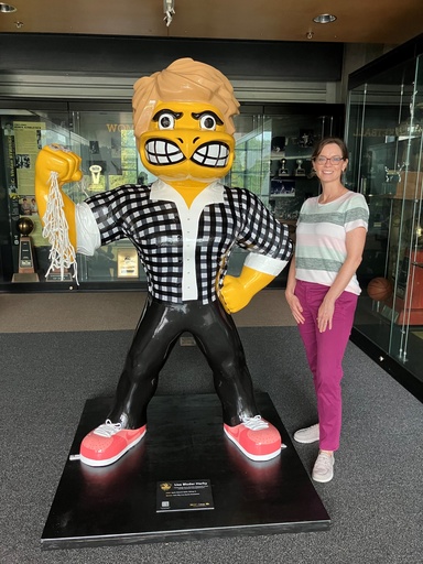 Jen poses with a Herky.